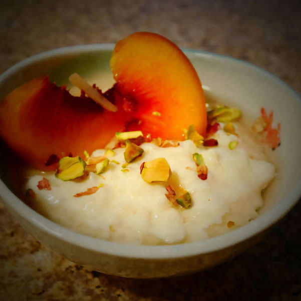 Milky Rice Pudding with Lemon Syrup and Peaches
