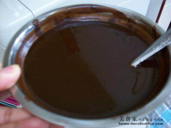 Adding melted butter and stirring until smooth for Making Rich Chocolate and Cheese for the New Year 2011